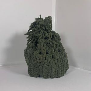 Hand crocheted beanie with a Pom Pom.